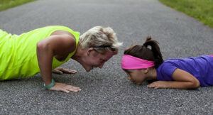 image of a woman and baby doing pushups