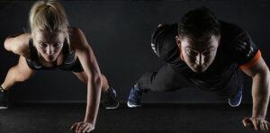image of a man and a woman doing one arm pushups